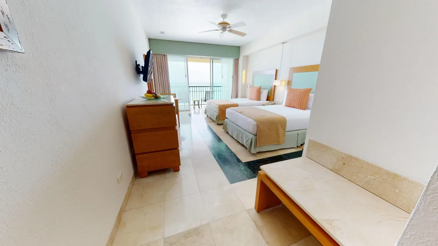 Premier Ocean Front Doble two-bed room with balcony beyond at Grand Park Royal Cancun.