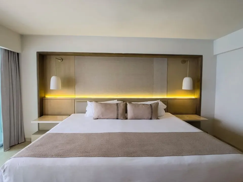 Premier Superior Ocean Front king bed in a guest room at Grand Park Royal Cancun.