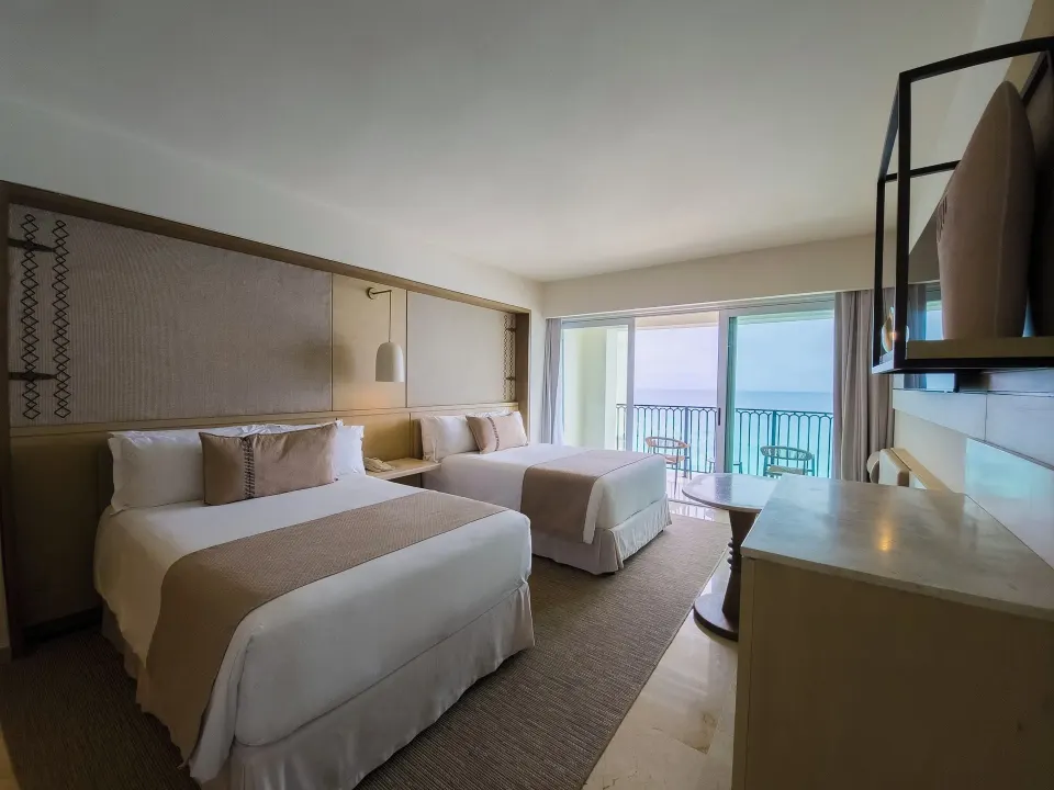 Premier Superior Ocean Front room with two beds and balcony at Grand Park Royal Cancun.