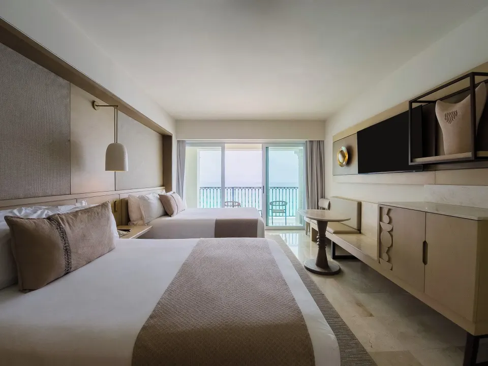 Premier Superior Ocean Front two-bed room with TV console at Grand Park Royal Cancun.