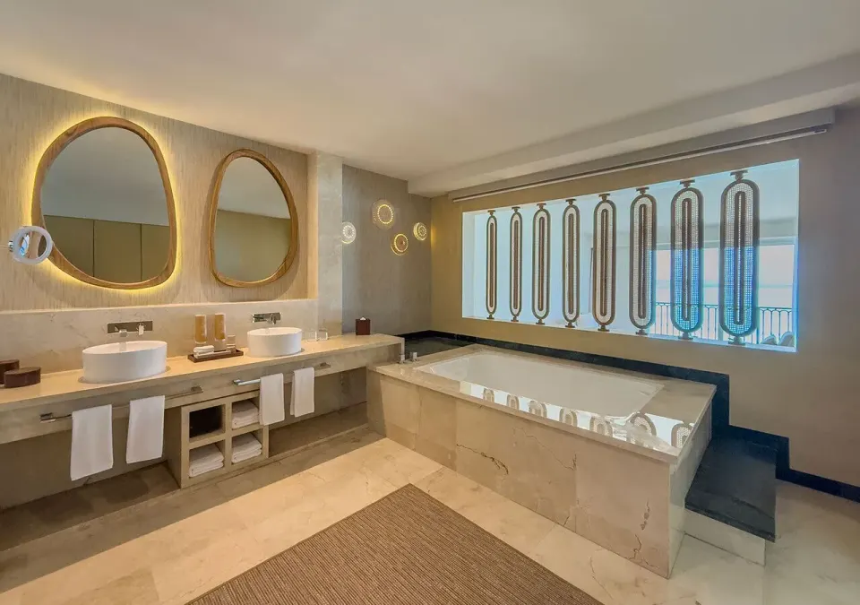 Royal Master Suite bathroom with hot tub and double sinks at Grand Park Royal Cancun.