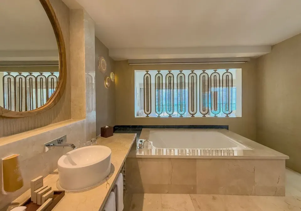 Royal Master Suite bathroom hot tub and vanity at Grand Park Royal Cancun.
