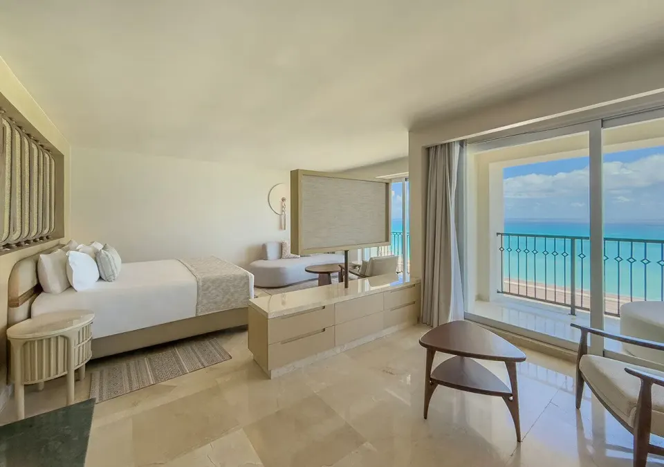 Royal Master Suite king bed and oceanfront balcony at Grand Park Royal Cancun.