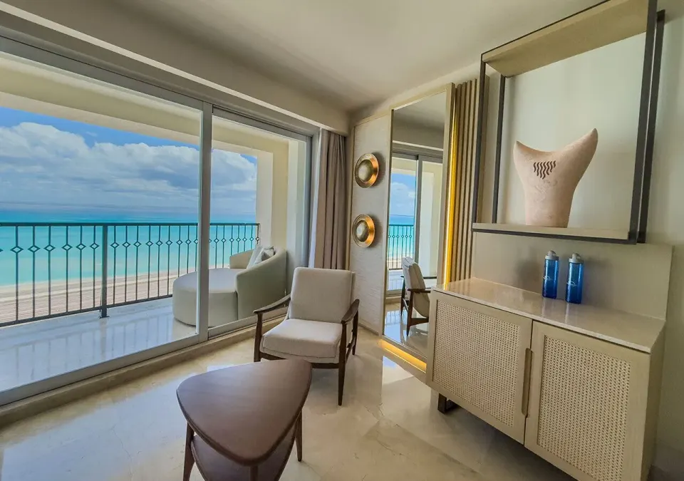 Royal Master Suite sitting area and balcony ocean view at Grand Park Royal Cancun.