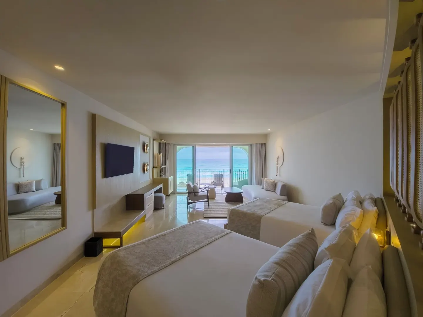 Royal Suite Doble with two beds and ocean-facing balcony at Grand Park Royal Cancun.
