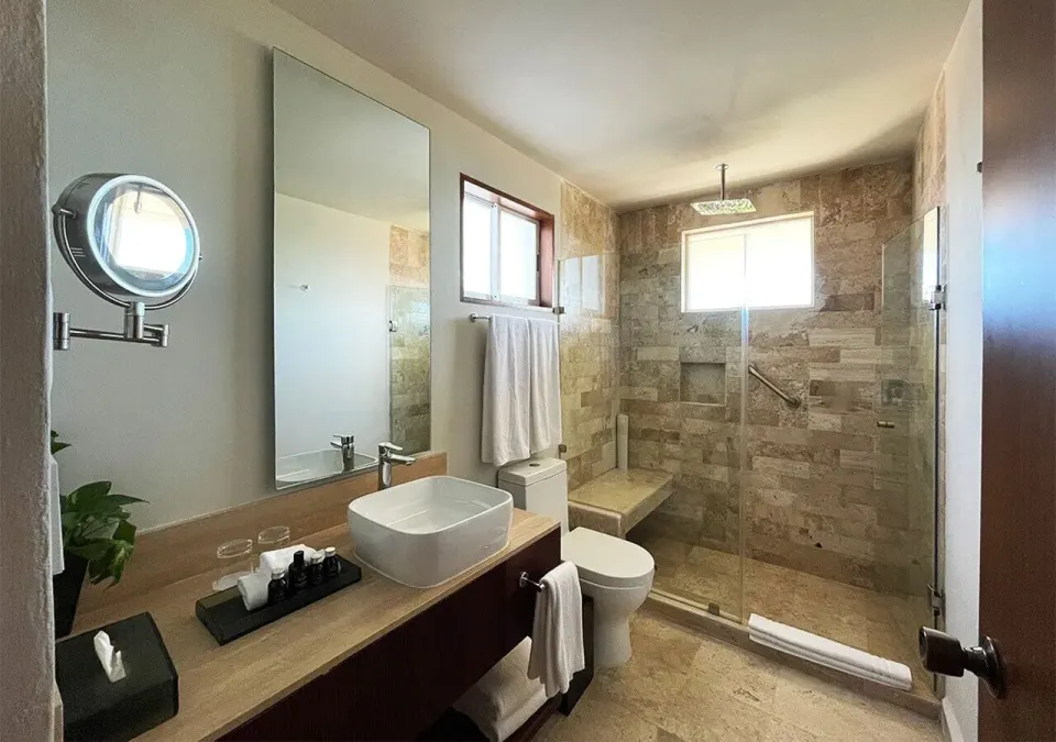 Villa Deluxe Ocean Front bathroom with vessel sink and walk-in shower at Grand Park Royal Cancun.