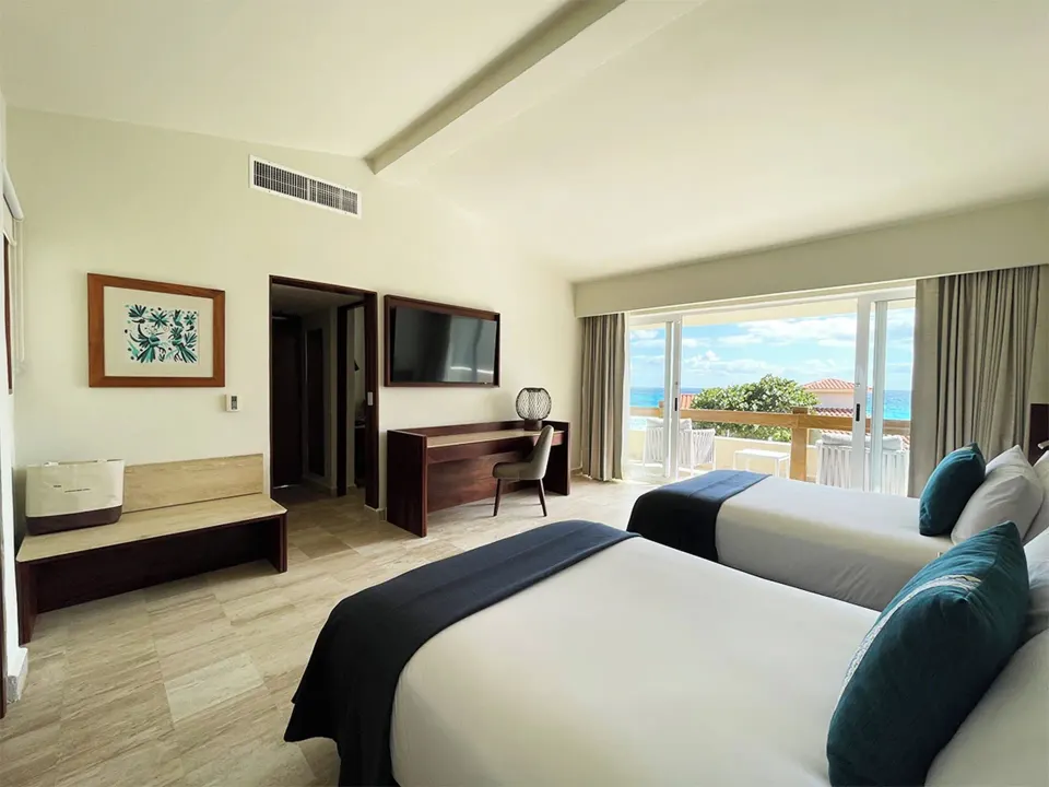 Villa Deluxe Ocean Front room with two beds and balcony at Grand Park Royal Cancun.
