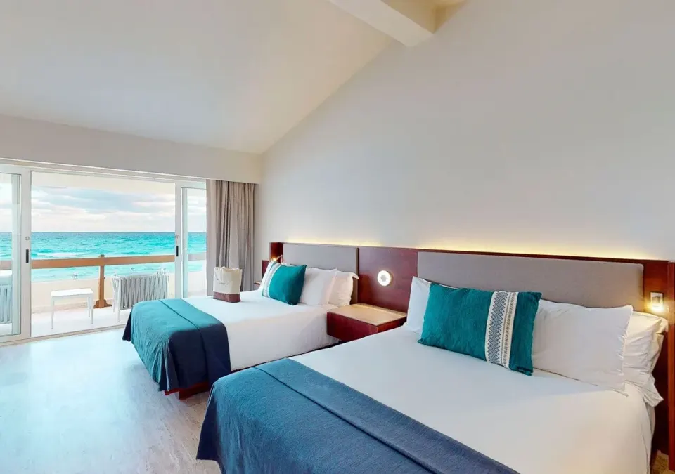 Villa Deluxe Ocean Front two beds beside balcony at Grand Park Royal Cancun.
