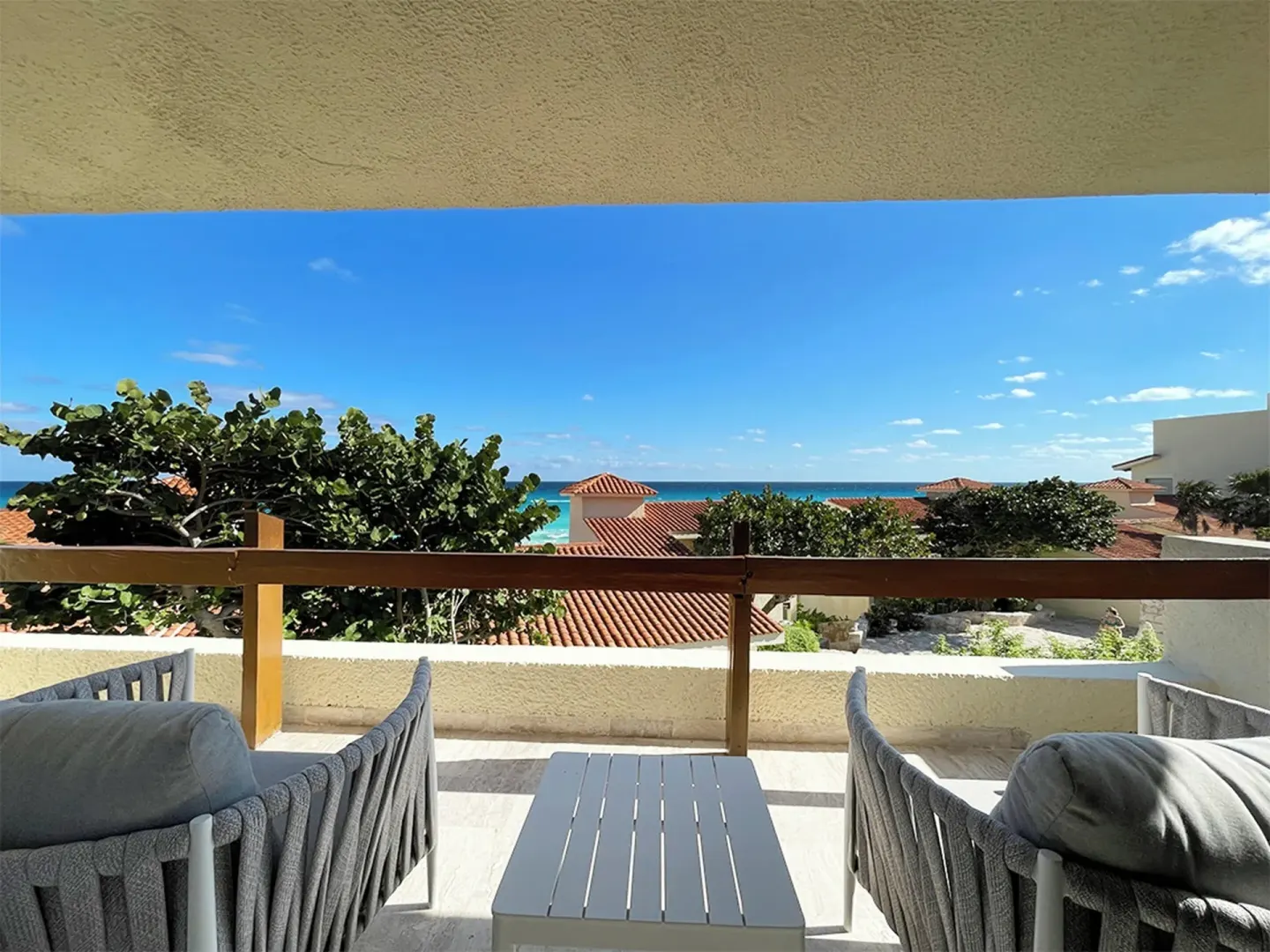 Villa Deluxe terrace with seating and ocean view at Grand Park Royal Cancun.
