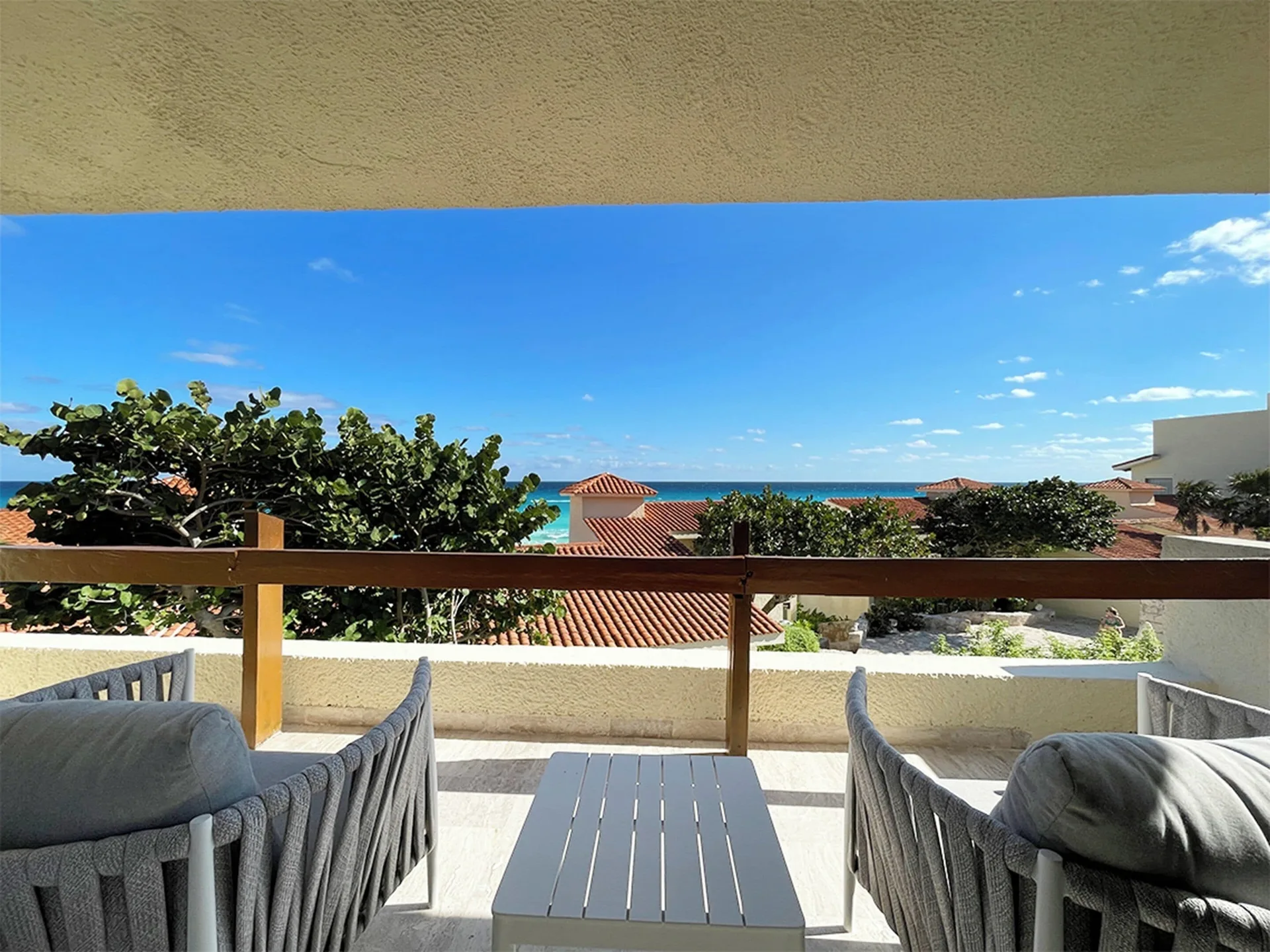 Villa Deluxe terrace with seating and ocean view at Grand Park Royal Cancun.