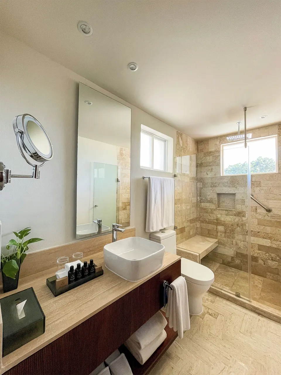 Villa Junior Suite bathroom with vanity and glass shower at Grand Park Royal Cancun.