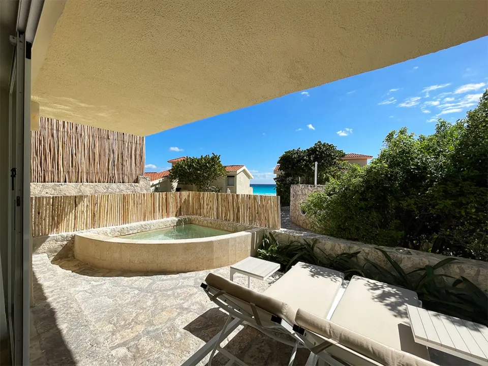 Private plunge pool patio with loungers at Grand Park Royal Cancun.