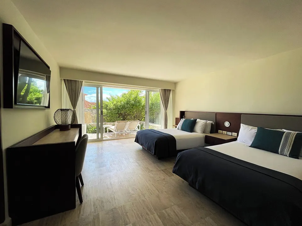 Villa Junior Suite with two beds and patio doors at Grand Park Royal Cancun.