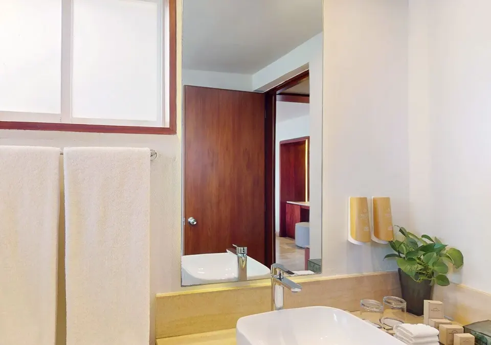 Villa Premier Plungepool Oceanfront bathroom sink and mirror at Grand Park Royal Cancun.