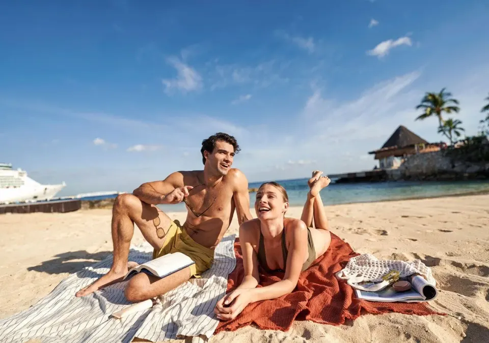 Couple relaxing on the sandy beach at Grand Park Royal Cozumel