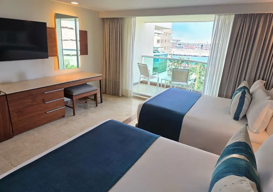 Two beds and balcony with marina and cruise ship view at Grand Park Royal Cozumel