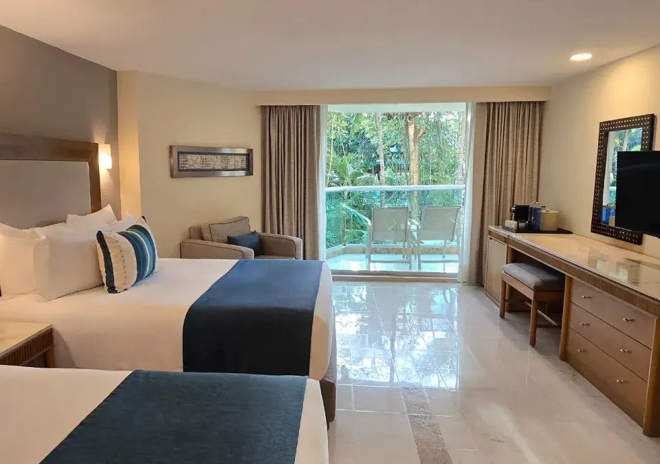 Deluxe Nature View Double room interior with balcony at Grand Park Royal Cozumel