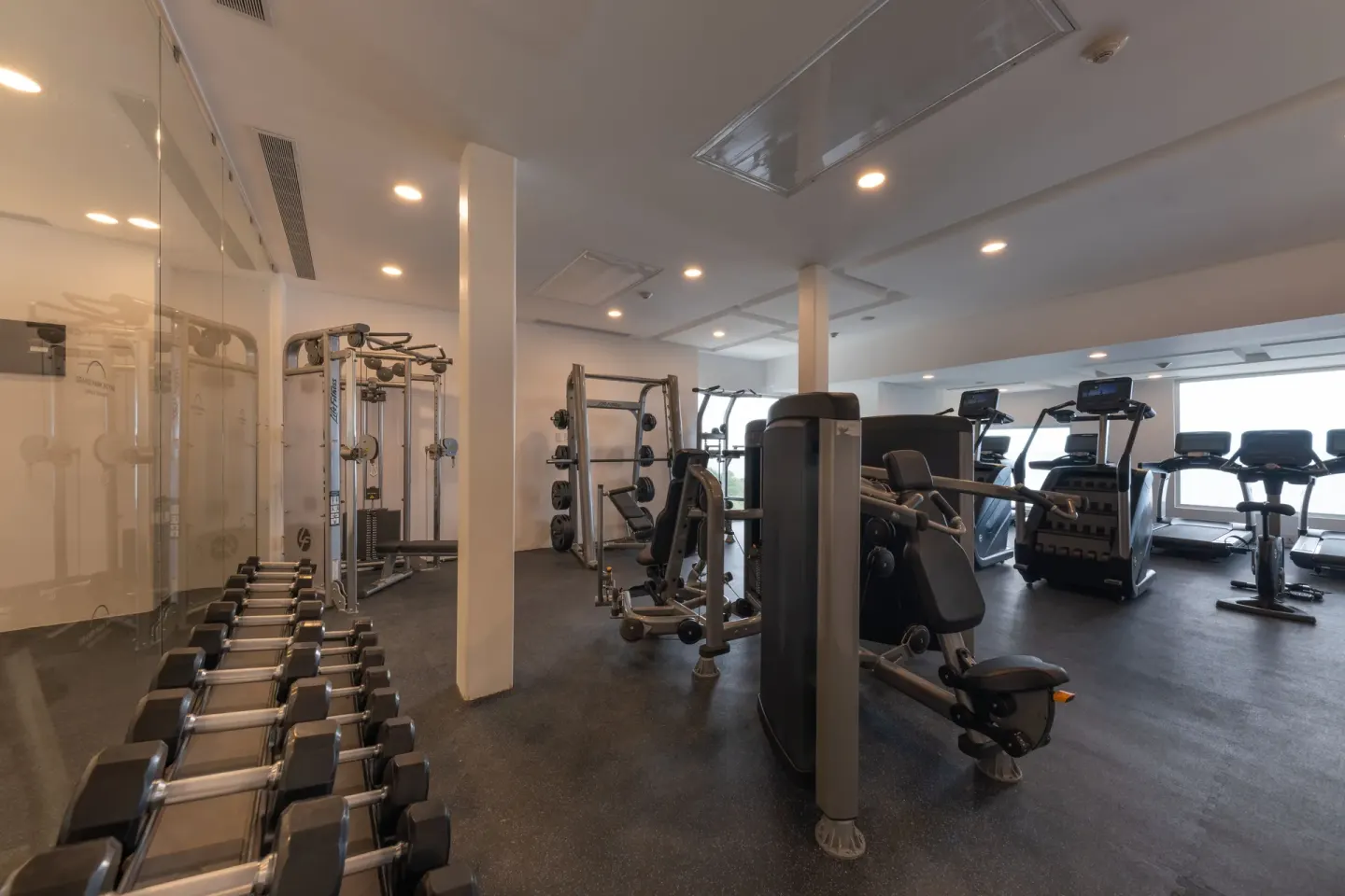 Fitness center with weights and cardio machines at Grand Park Royal Puerto Vallarta.