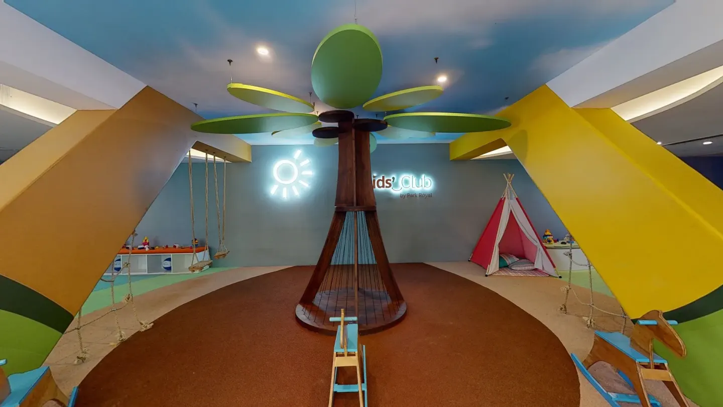 Colorful kids club playroom with swings at Grand Park Royal Puerto Vallarta.