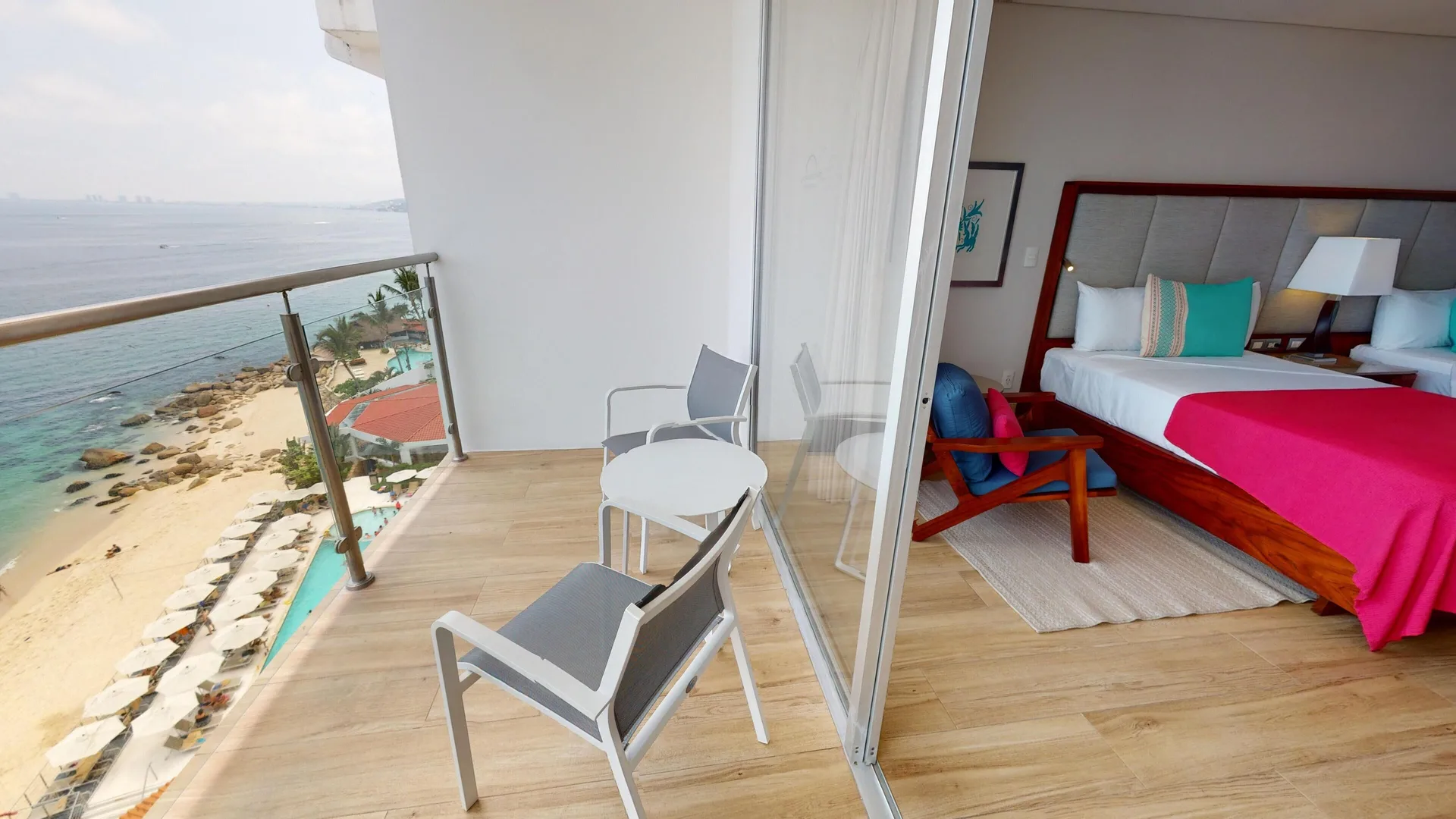 Deluxe Ocean Front room balcony and two beds at Grand Park Royal Puerto Vallarta.