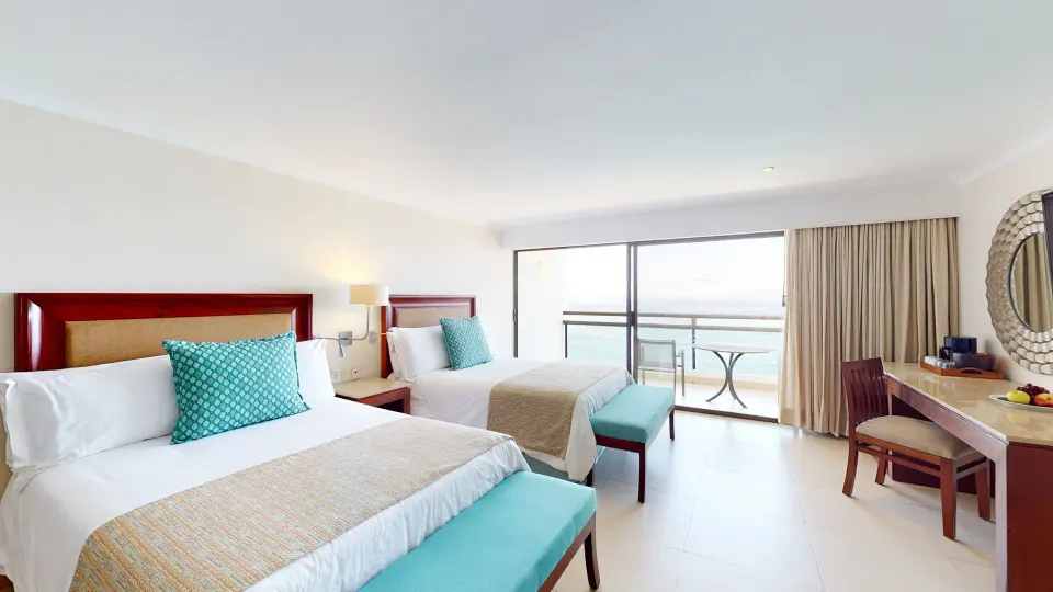Junior Suite with two beds and balcony at Grand Park Royal Puerto Vallarta.