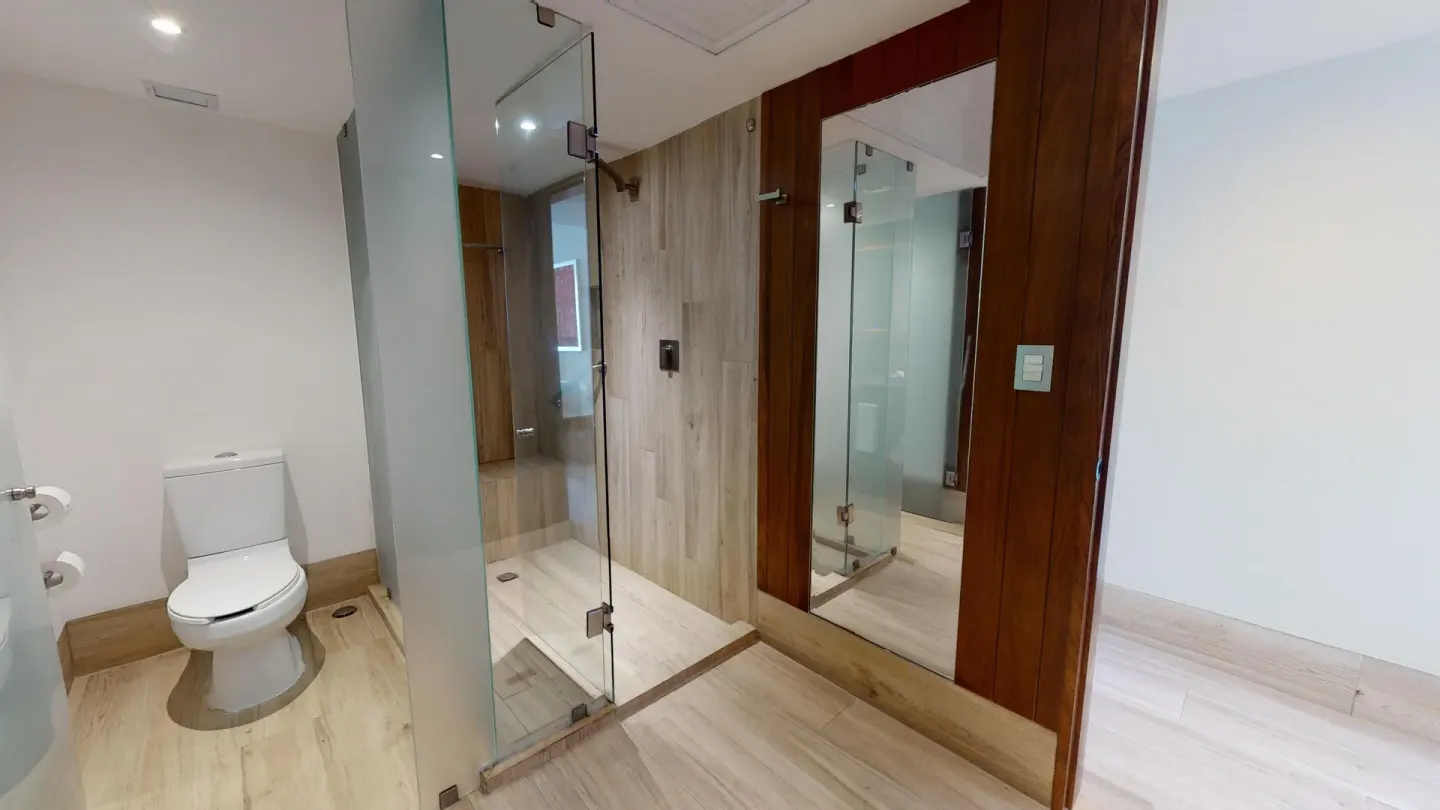 Premier Ocean Front bathroom with glass shower at Grand Park Royal Puerto Vallarta.