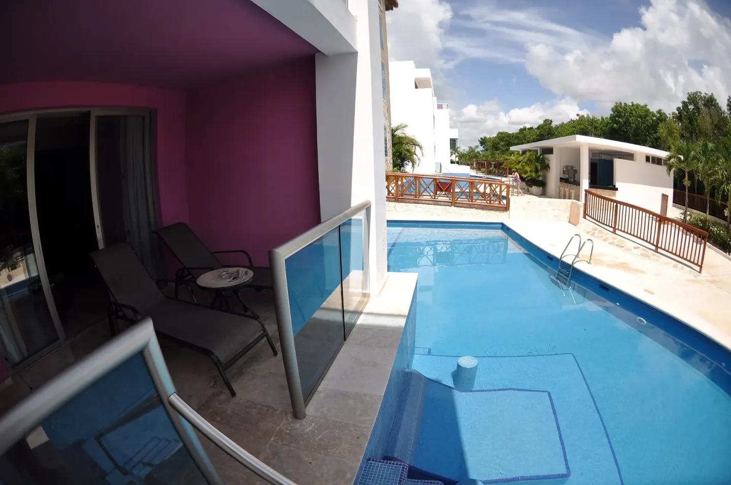 Ground-floor terrace beside a swim-up pool at Grand Riviera Princess.