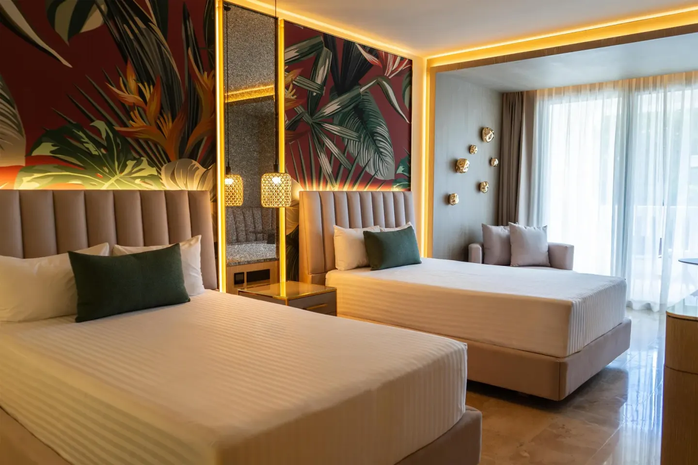 Guest room with two double beds and tropical wall panels at Grand Riviera Princess.