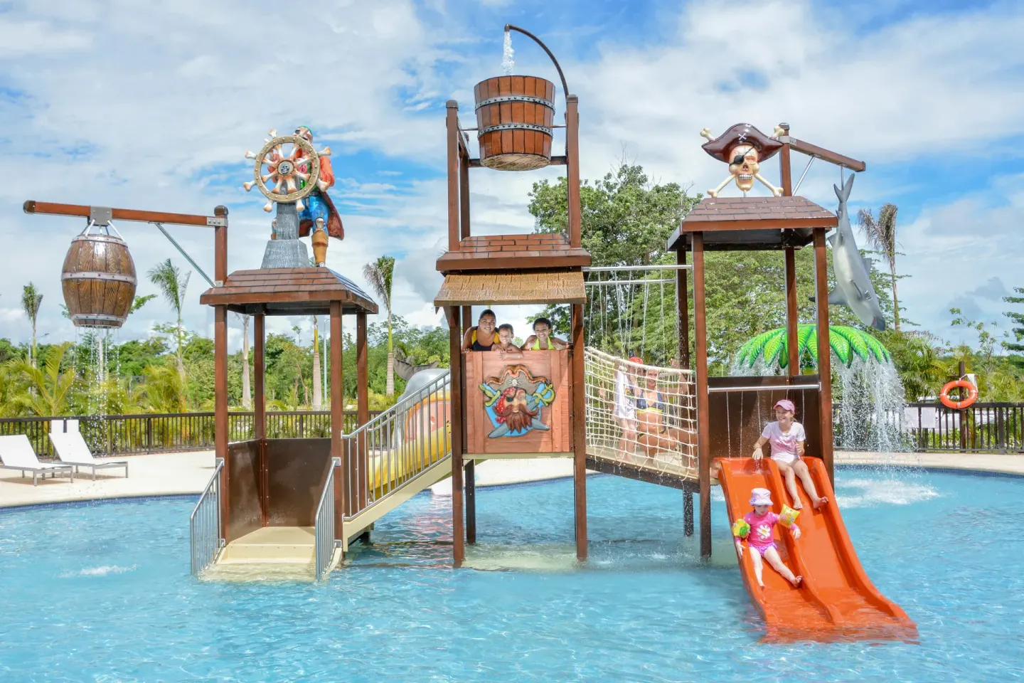 Pirate-themed splash pool with orange slides at Grand Riviera Princess.