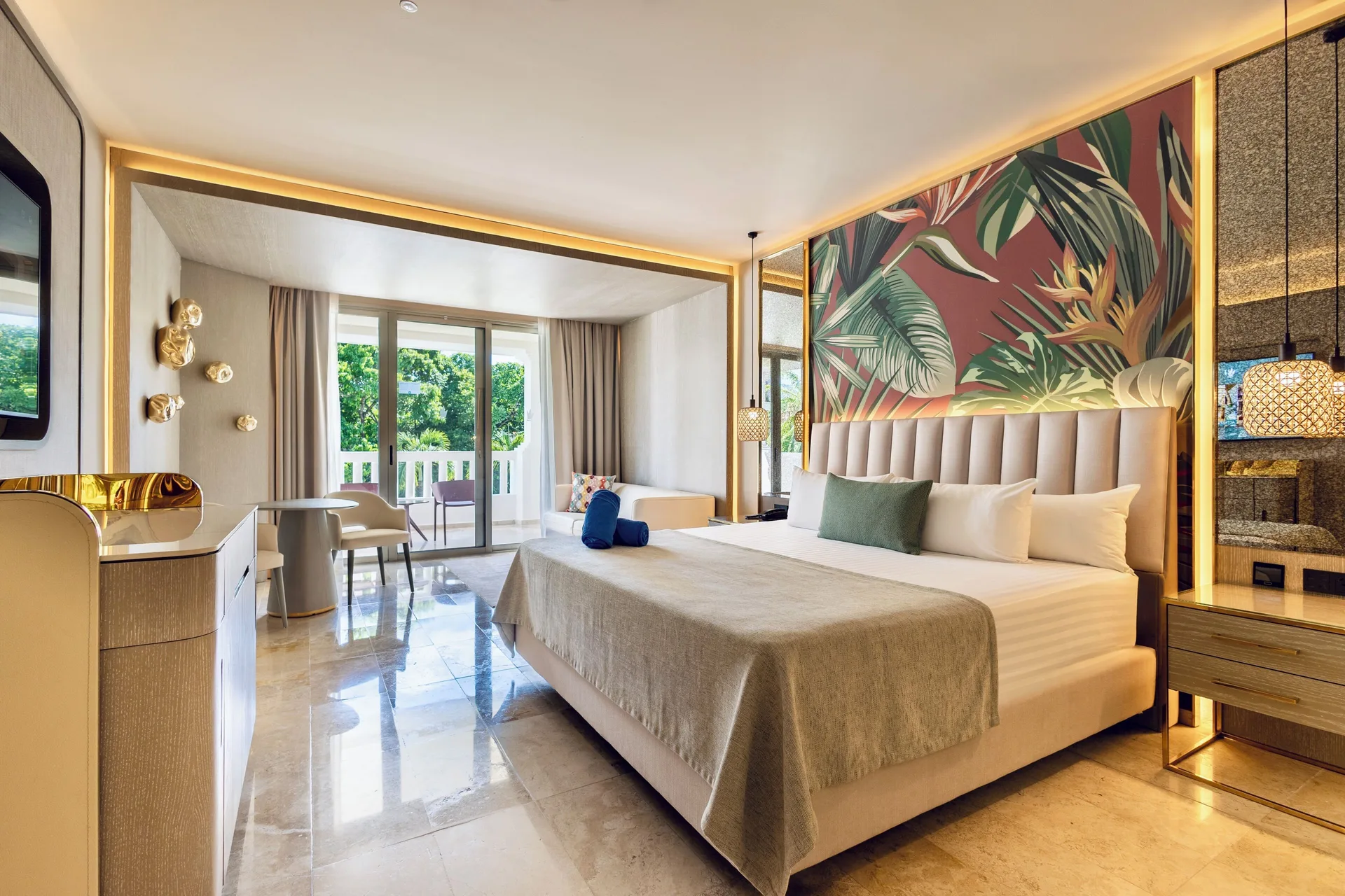 Deluxe Room Garden View with king bed, seating area, and balcony at Grand Riviera Princess.