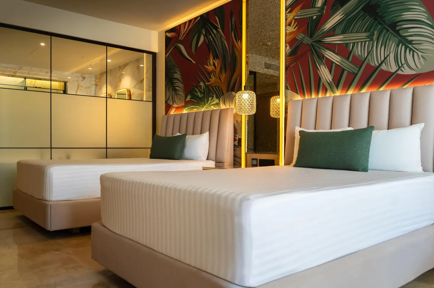 Deluxe Room Garden View with two beds and tropical wall art at Grand Riviera Princess.