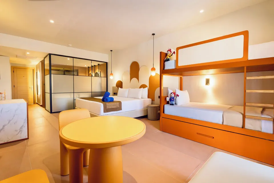 Family Club Deluxe room with king bed and bunk beds at Grand Riviera Princess.