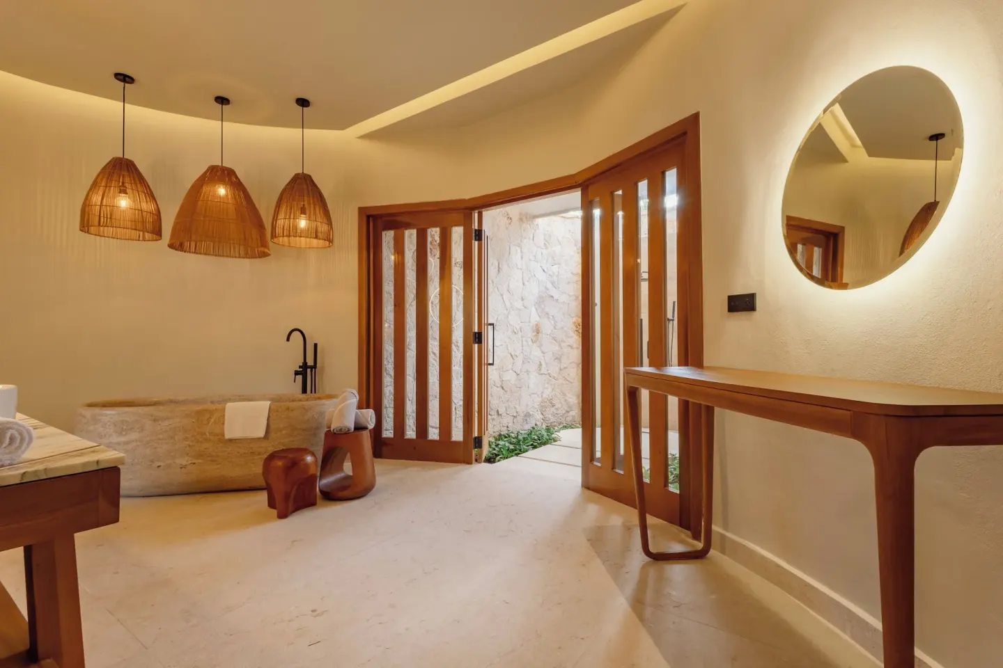 Laguna Villa Suite bathroom with soaking tub and round mirror at Grand Riviera Princess.