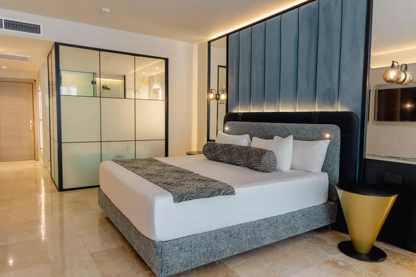 Platinum Suite king bed and glass shower partition at Grand Riviera Princess.