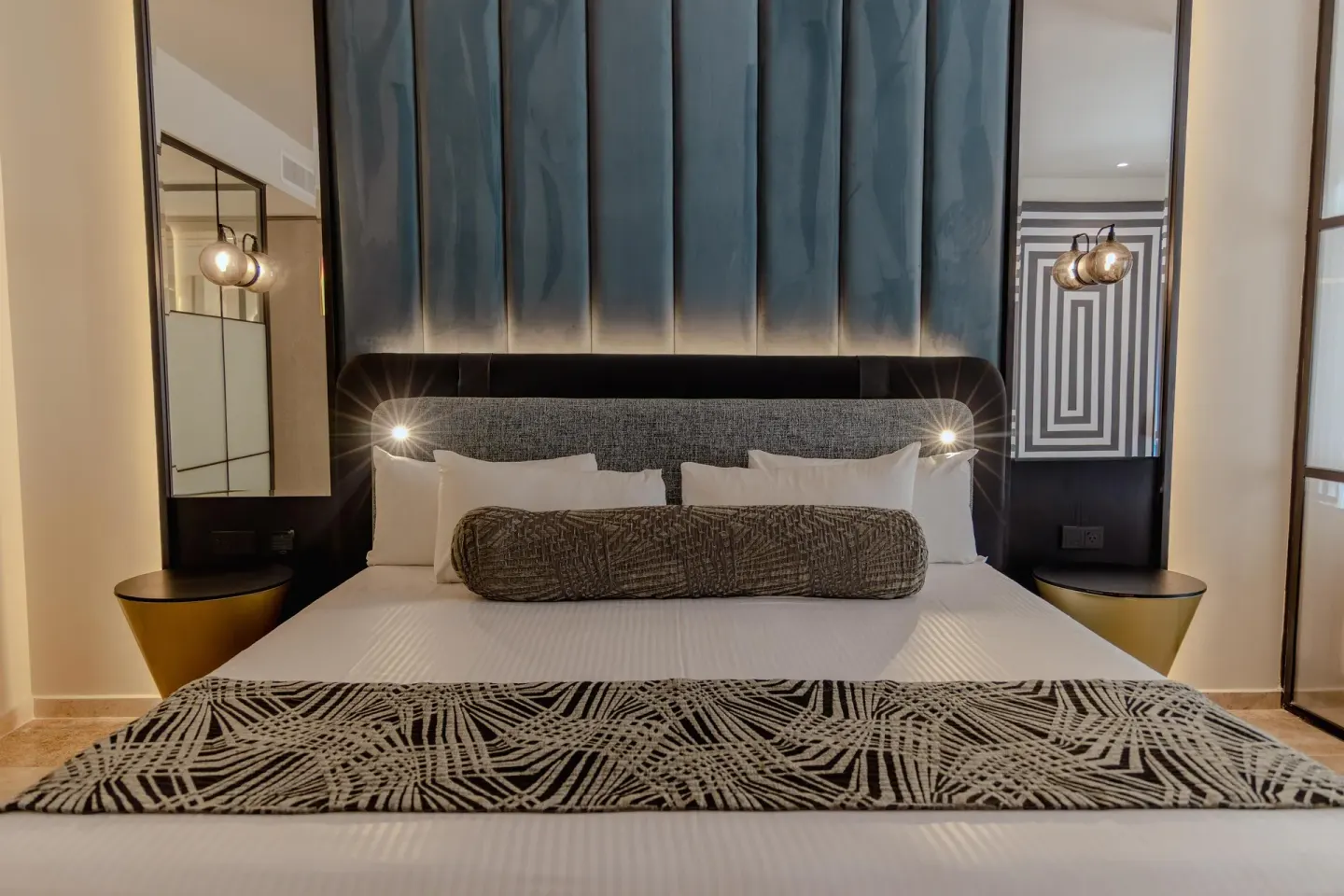 Platinum Suite king bed with mirrored panels at Grand Riviera Princess.