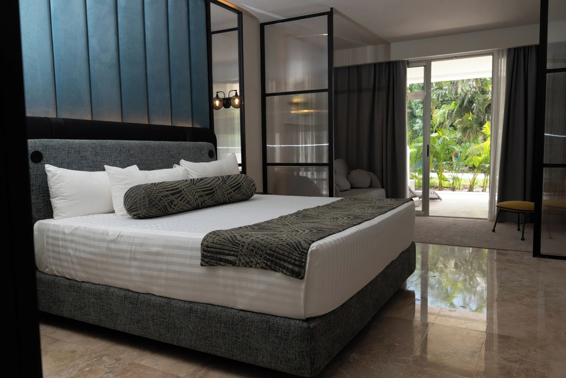 Platinum Suite king bed and patio doors at Grand Riviera Princess.