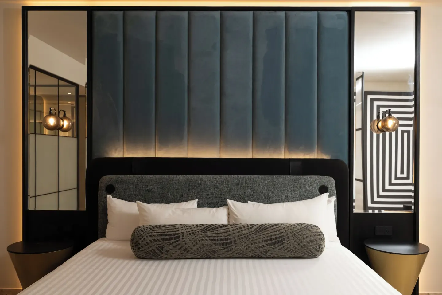 Platinum Suite king bed with tall blue headboard at Grand Riviera Princess.