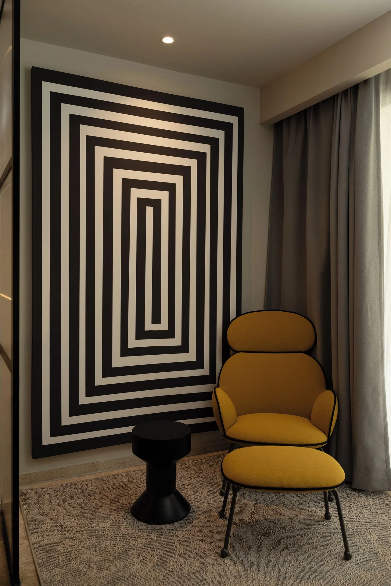 Platinum Suite lounge chair and geometric wall art at Grand Riviera Princess.