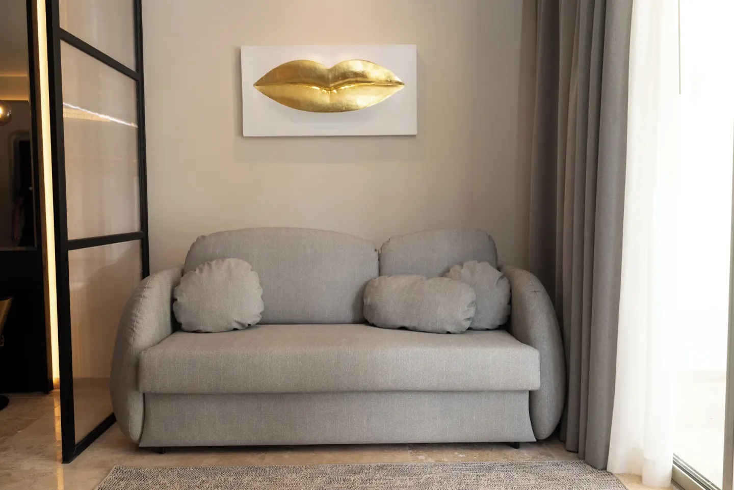 Platinum Suite sofa with gold lips wall art at Grand Riviera Princess.