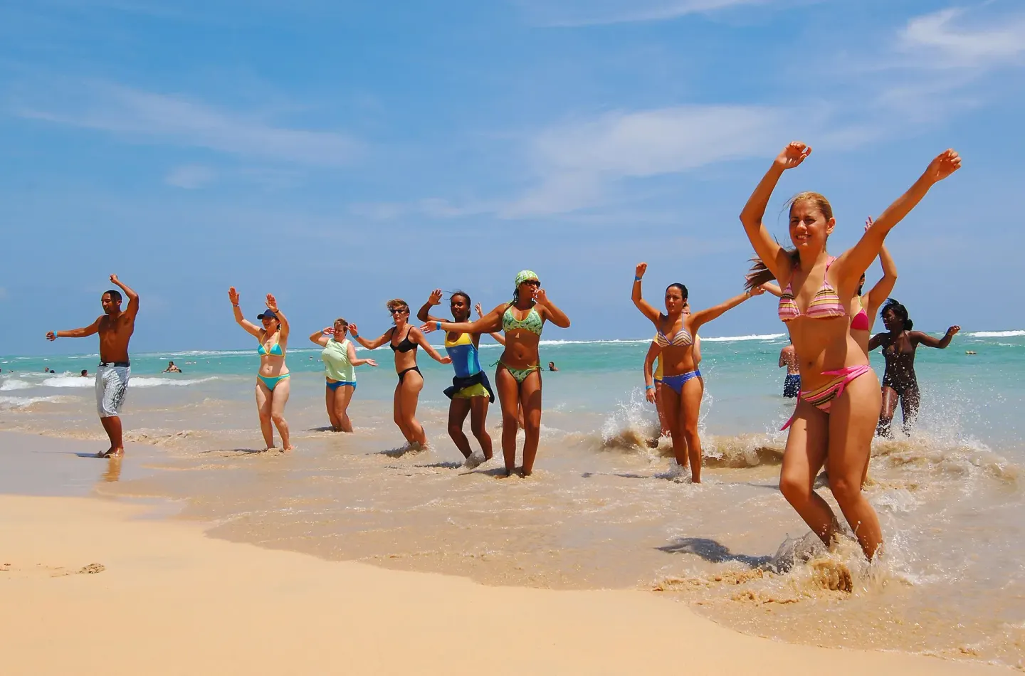 Beach activity group in the surf at Grand Sirenis Punta Cana Resort & Aquagames.