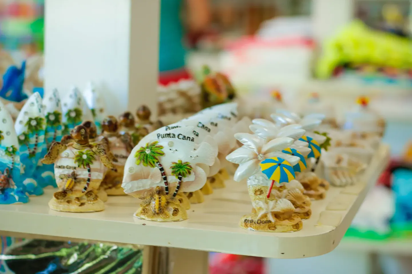 Small beach-themed souvenirs on a shelf at Grand Sirenis Punta Cana Resort & Aquagames.