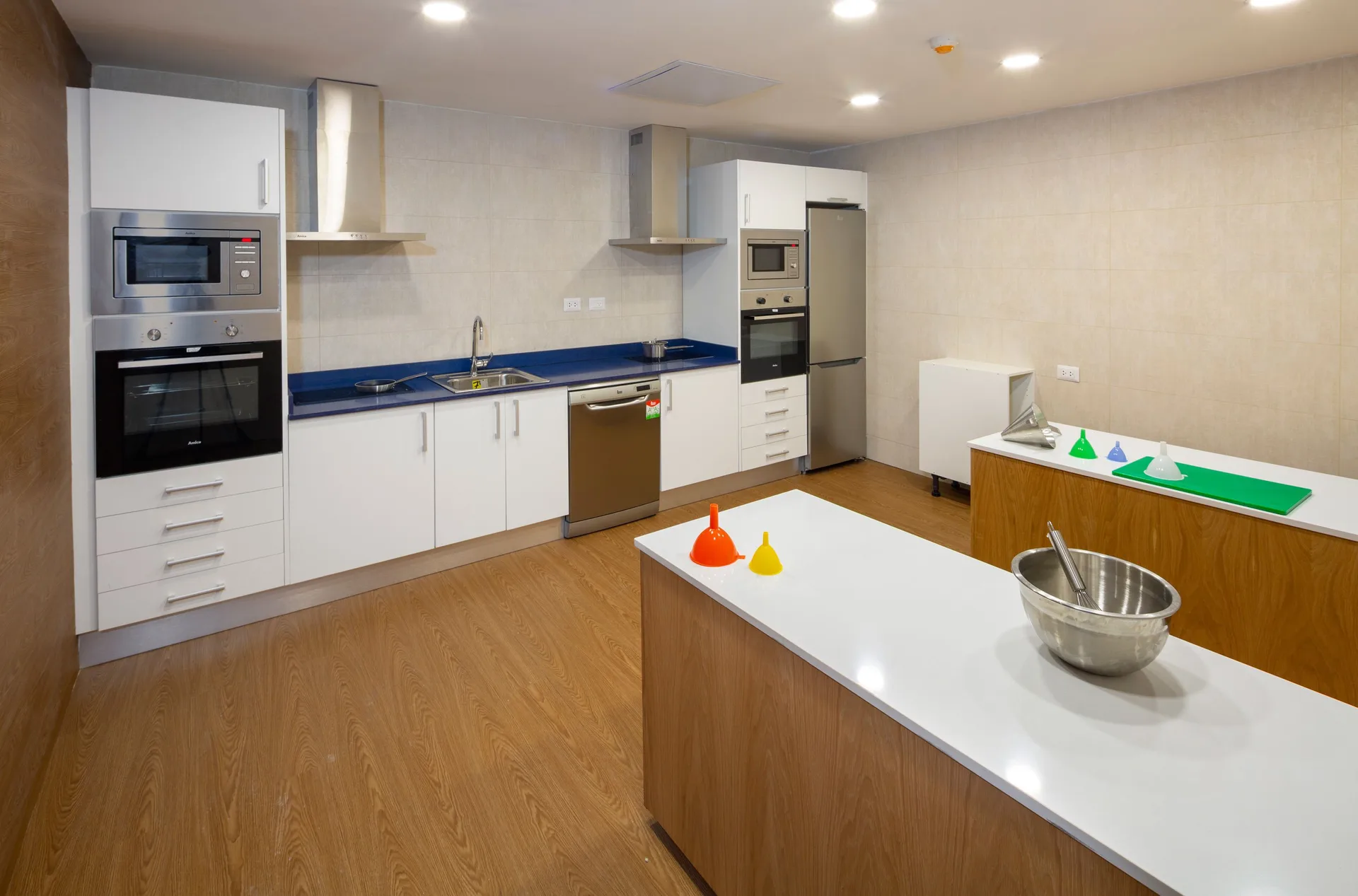 Cooking classroom with island counter and kitchen appliances at Grand Sirenis Punta Cana Resort & Aquagames.