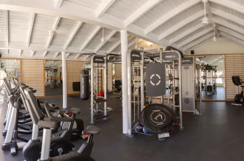 Fitness room with bikes and cable machines at Grand Sirenis Punta Cana Resort & Aquagames.