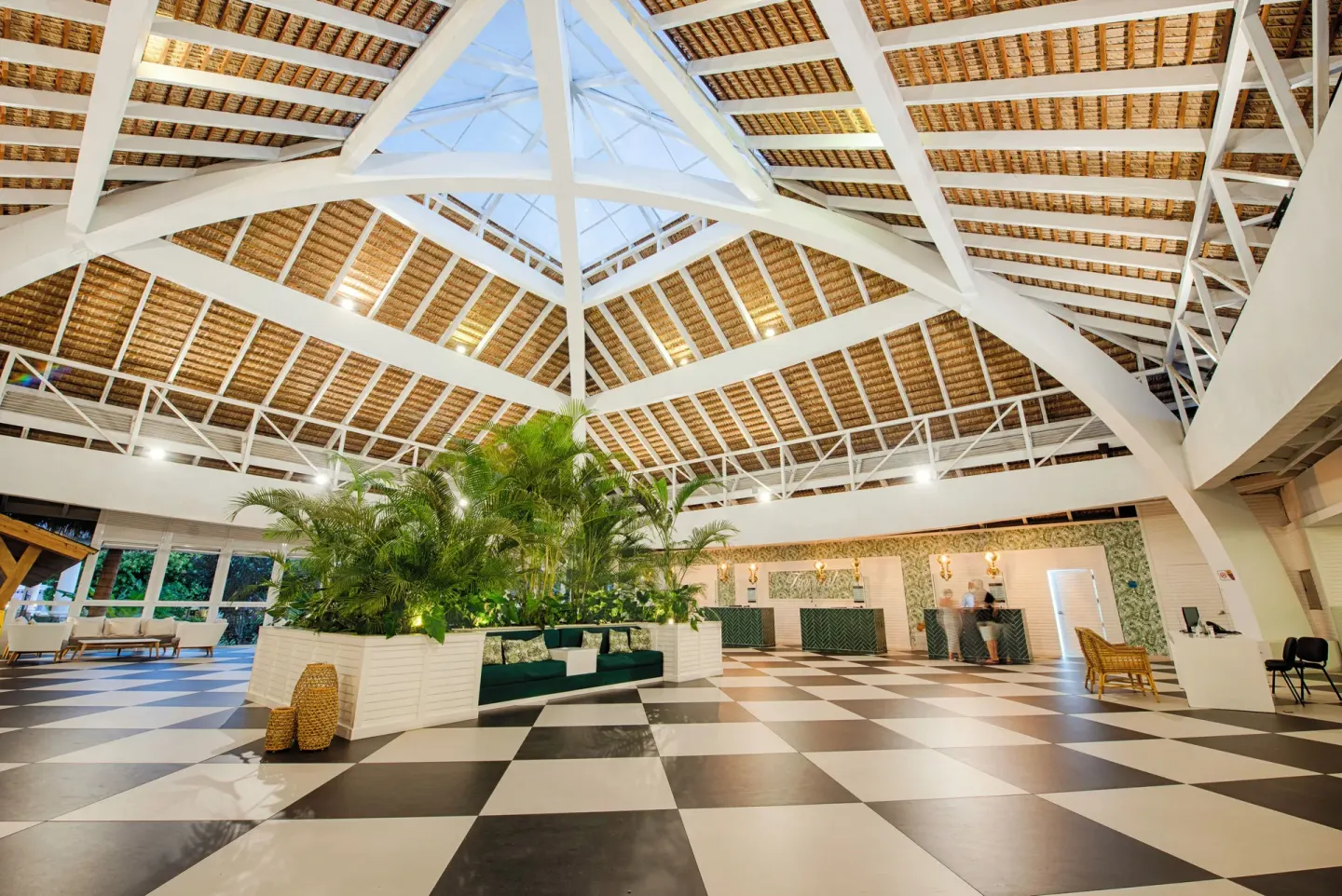 Open-air lobby with checkered floor at Grand Sirenis Punta Cana Resort & Aquagames.