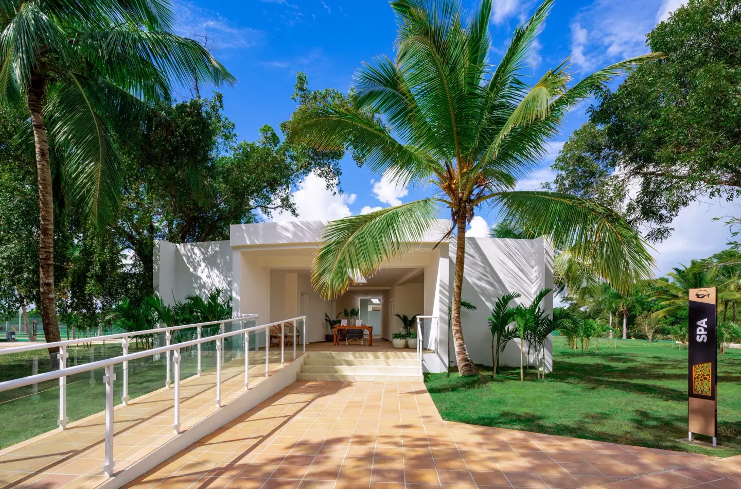 Spa entrance path with palms at Grand Sirenis Punta Cana Resort & Aquagames.