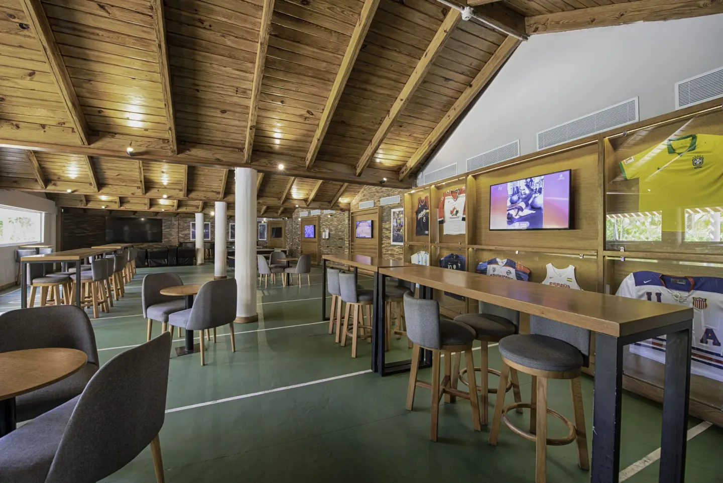 Sports-themed lounge with jerseys at Grand Sirenis Punta Cana Resort & Aquagames.