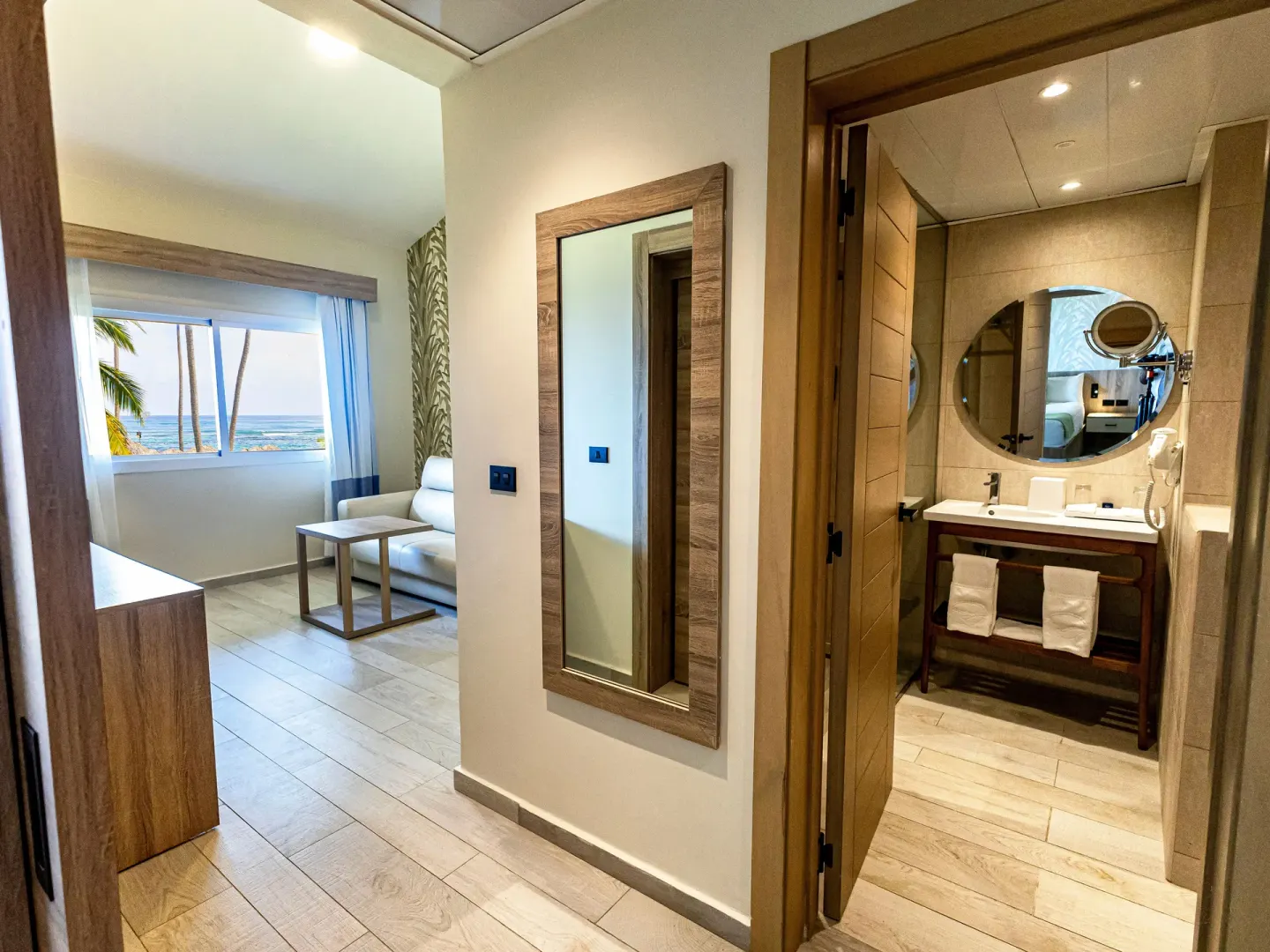Family Suite entry, living area, and bathroom at Grand Sirenis Punta Cana Resort & Aquagames.
