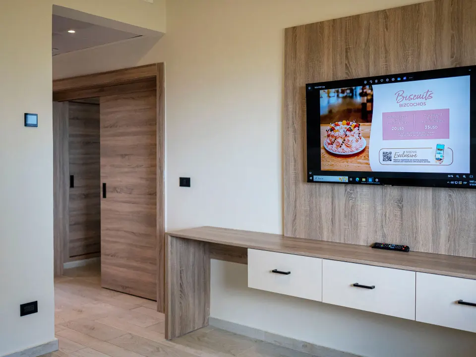 TV wall and desk in a Family Suite at Grand Sirenis Punta Cana Resort & Aquagames.