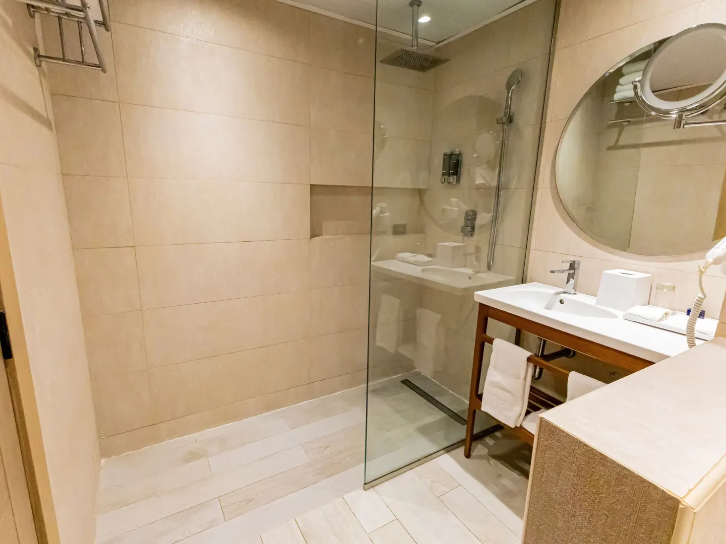Walk-in shower and vanity in a Family Suite at Grand Sirenis Punta Cana Resort & Aquagames.