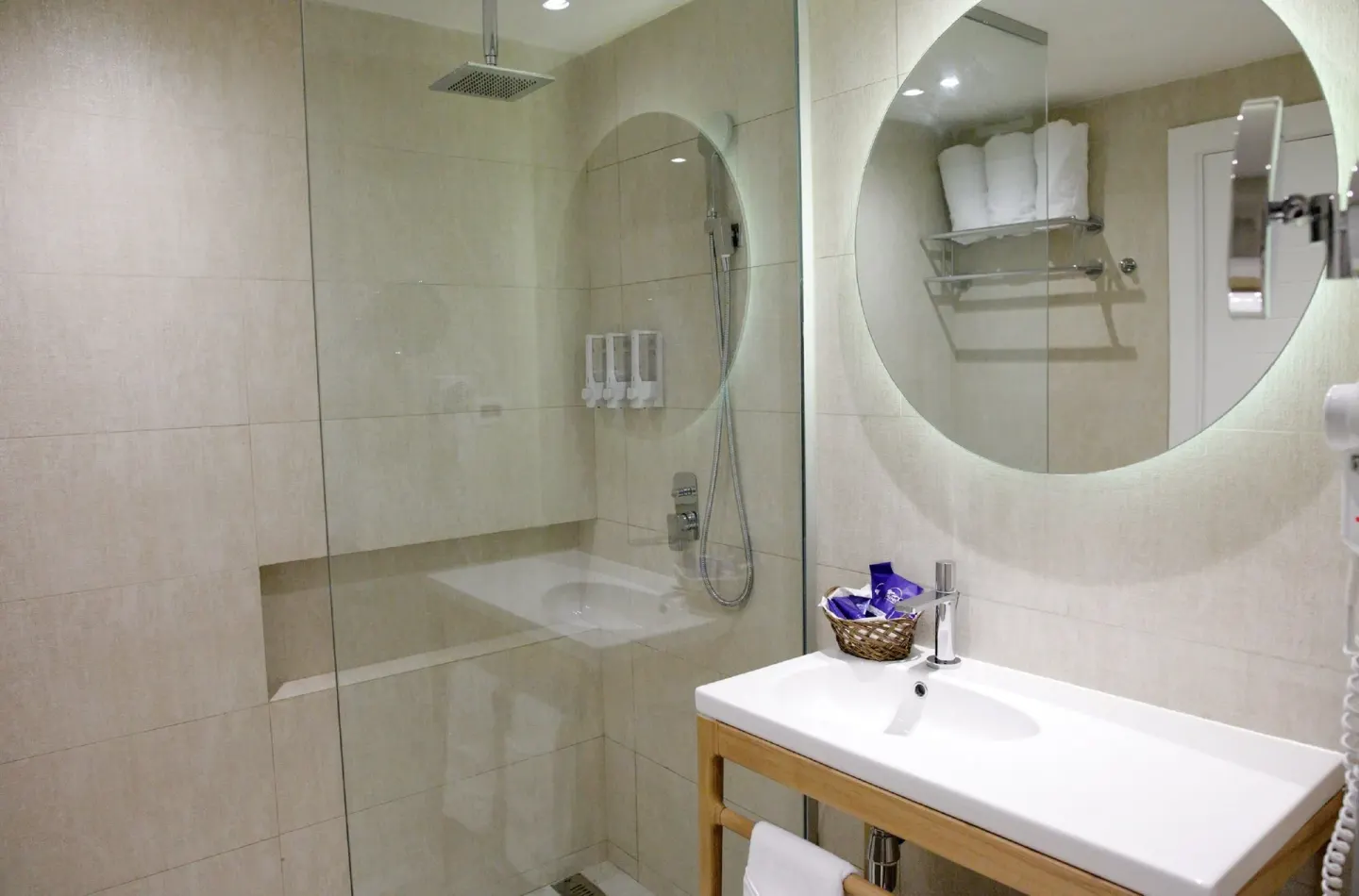 Standard Room bathroom with glass shower at Grand Sirenis Punta Cana Resort & Aquagames.